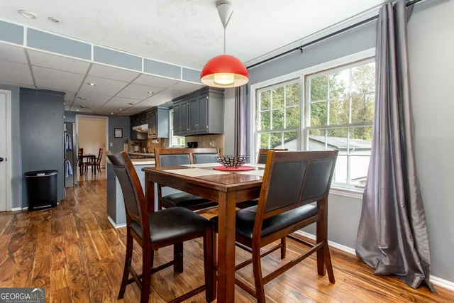 a view of a dining room with furniture window and outside view