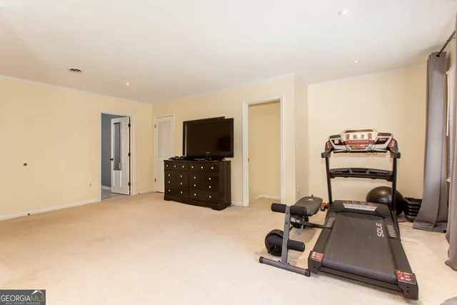 a room with furniture and a flat screen tv