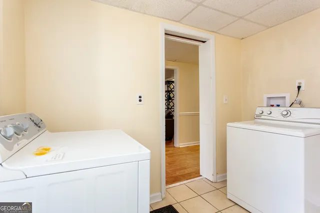 a utility room with dryer and washer