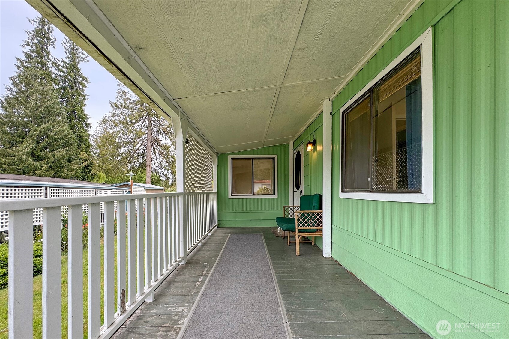90 Baywood Village Road, Unit 34 Sequim, WA 98382 - Photo 5 of 40 a view of a house with a backyard