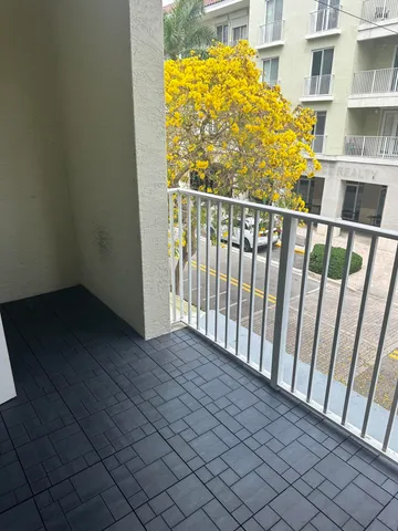 a view of a kitchen with a sink and a refrigerator