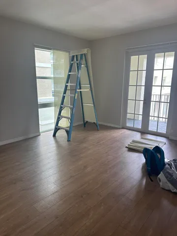 a view of an empty room and a window
