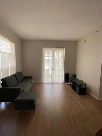 a kitchen with granite countertop a cabinets and a stove top oven