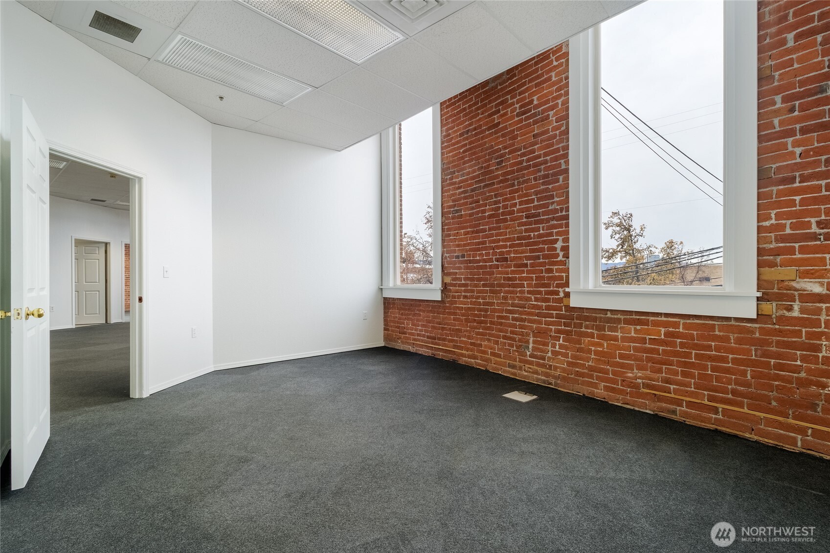 38 East Main Street Walla Walla, WA 99362 - Photo 19 of 24 a view of an empty room with a window