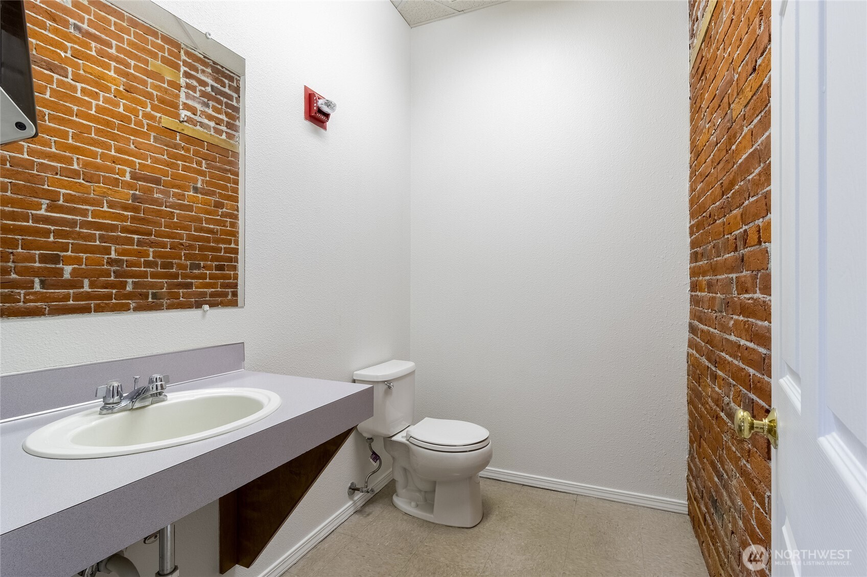 38 East Main Street Walla Walla, WA 99362 - Photo 21 of 24 a bathroom with a sink a toilet and mirror