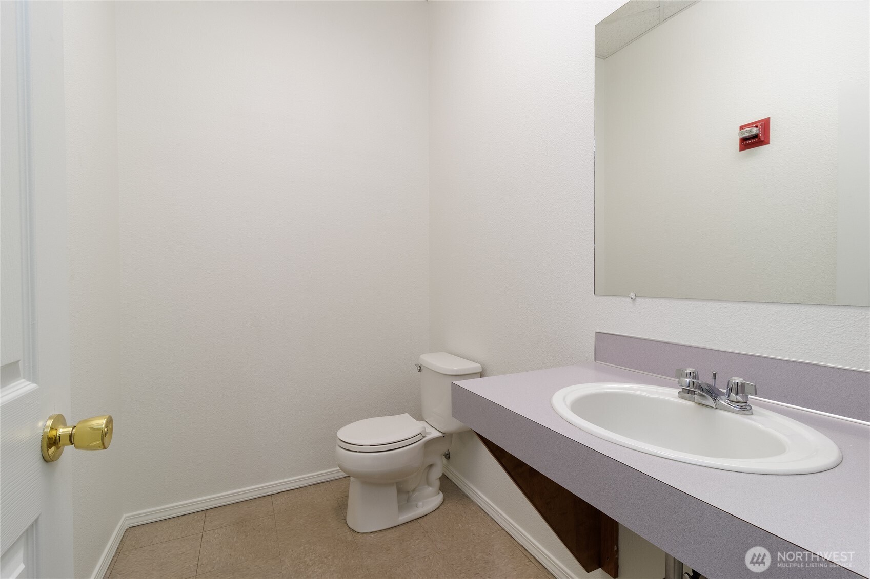 38 East Main Street Walla Walla, WA 99362 - Photo 22 of 24 a white toilet sitting next to a bathroom sink