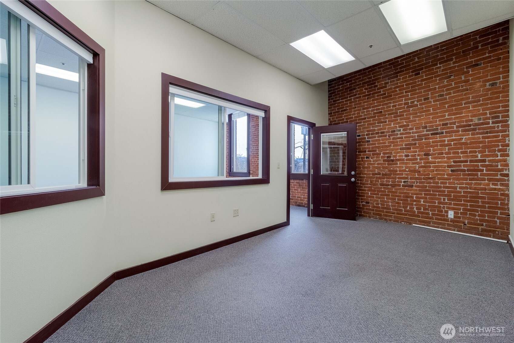 38 East Main Street Walla Walla, WA 99362 - Photo 10 of 24 a view of an empty room with brick wall and closet
