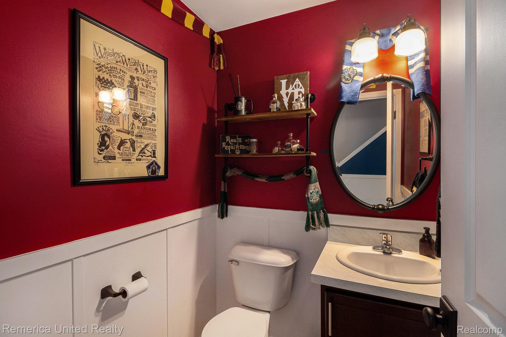 4142 Chase Ridge Lane Howell, MI 48843 - Photo 8 of 21 Bathroom featuring vanity, wainscoting, and a decorative wall
