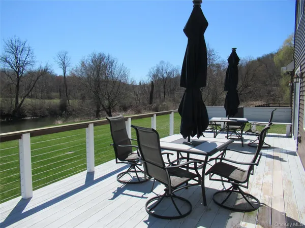 a view of a chairs and table in patio