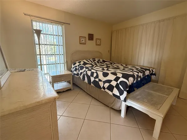 a bedroom with a bed and a walk in closet