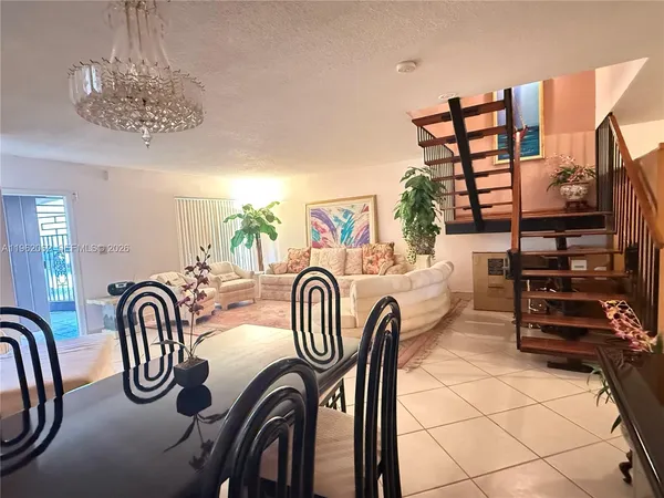 a bedroom with furniture and a chandelier