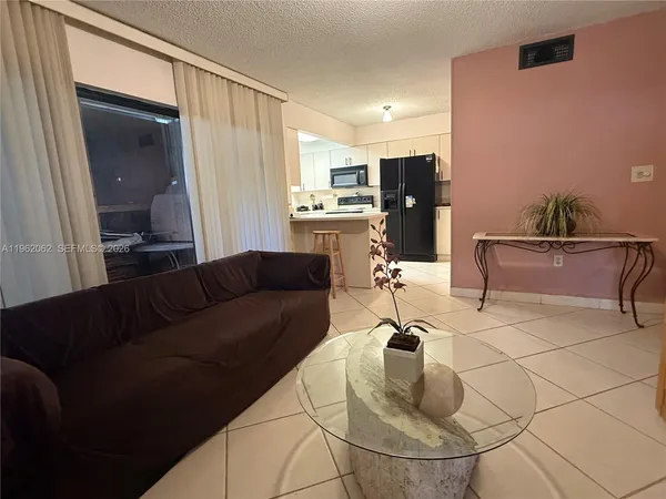 a living room with furniture and a table