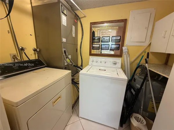 a utility room with dryer and washer