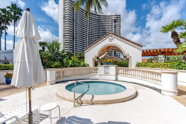 a view of a chair and tables in the balcony