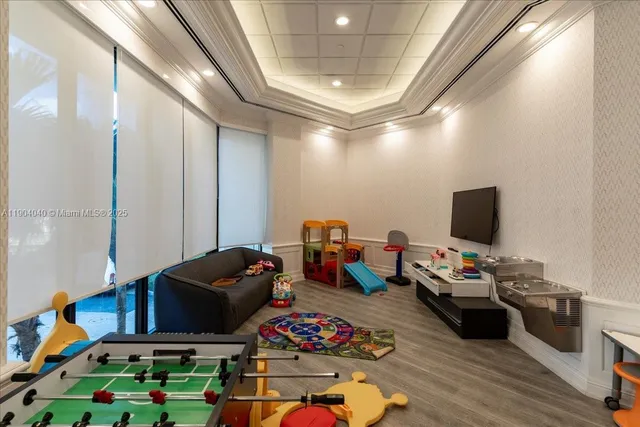 a bedroom with furniture and a flat screen tv