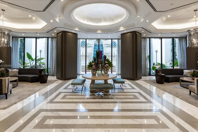 a view of a lobby with furniture and floor to ceiling windows