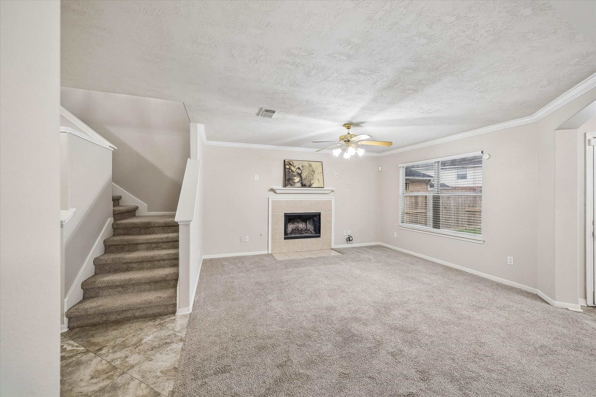 10307 Turrett Point Lane Houston, TX 77064 - Photo 5 of 12 a view of an empty room with a fireplace