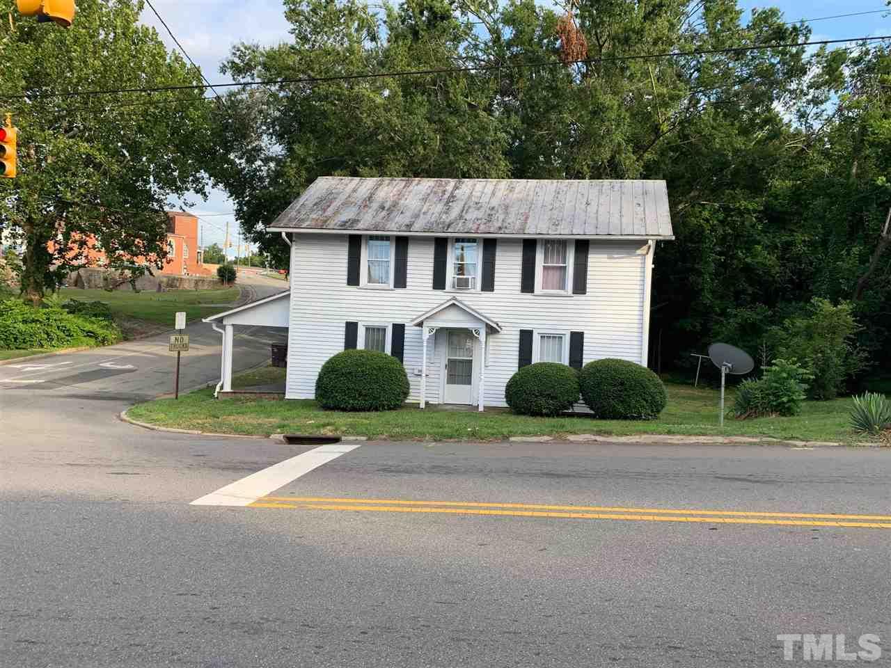 200 Leasburg Road Roxboro, NC 27573 - Photo 1 of 9 front view of a house with a yard