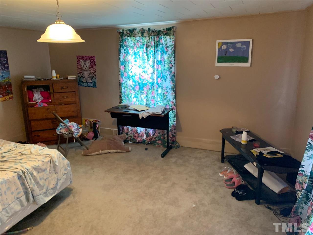 200 Leasburg Road Roxboro, NC 27573 - Photo 5 of 9 a bedroom with bed and a window