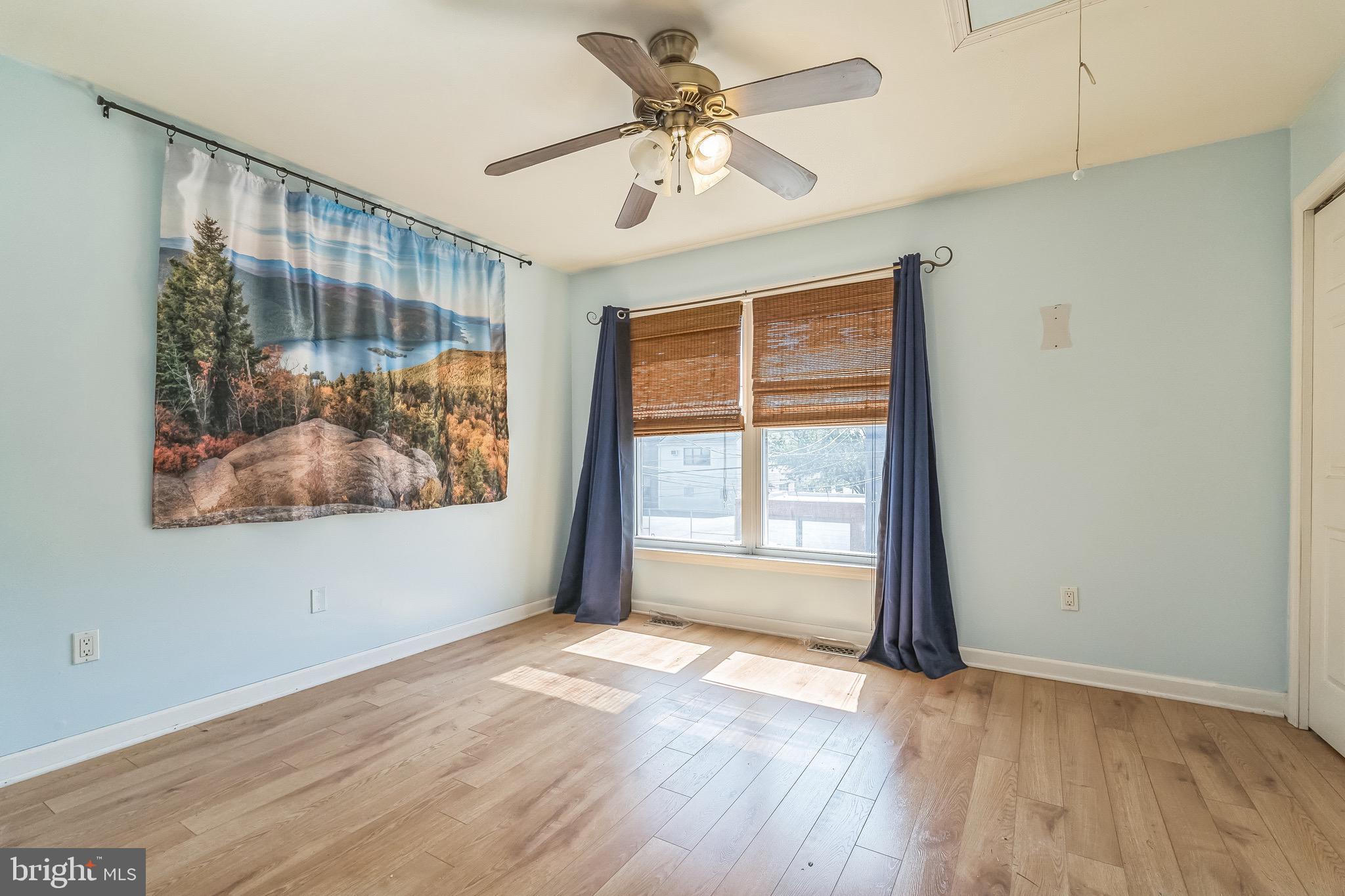 3566 Edgemont Street Philadelphia, PA 19134 - Photo 16 of 25 a view of an empty room with a window and wooden floor