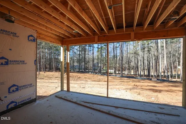 a living room with furniture a fireplace and a chandelier