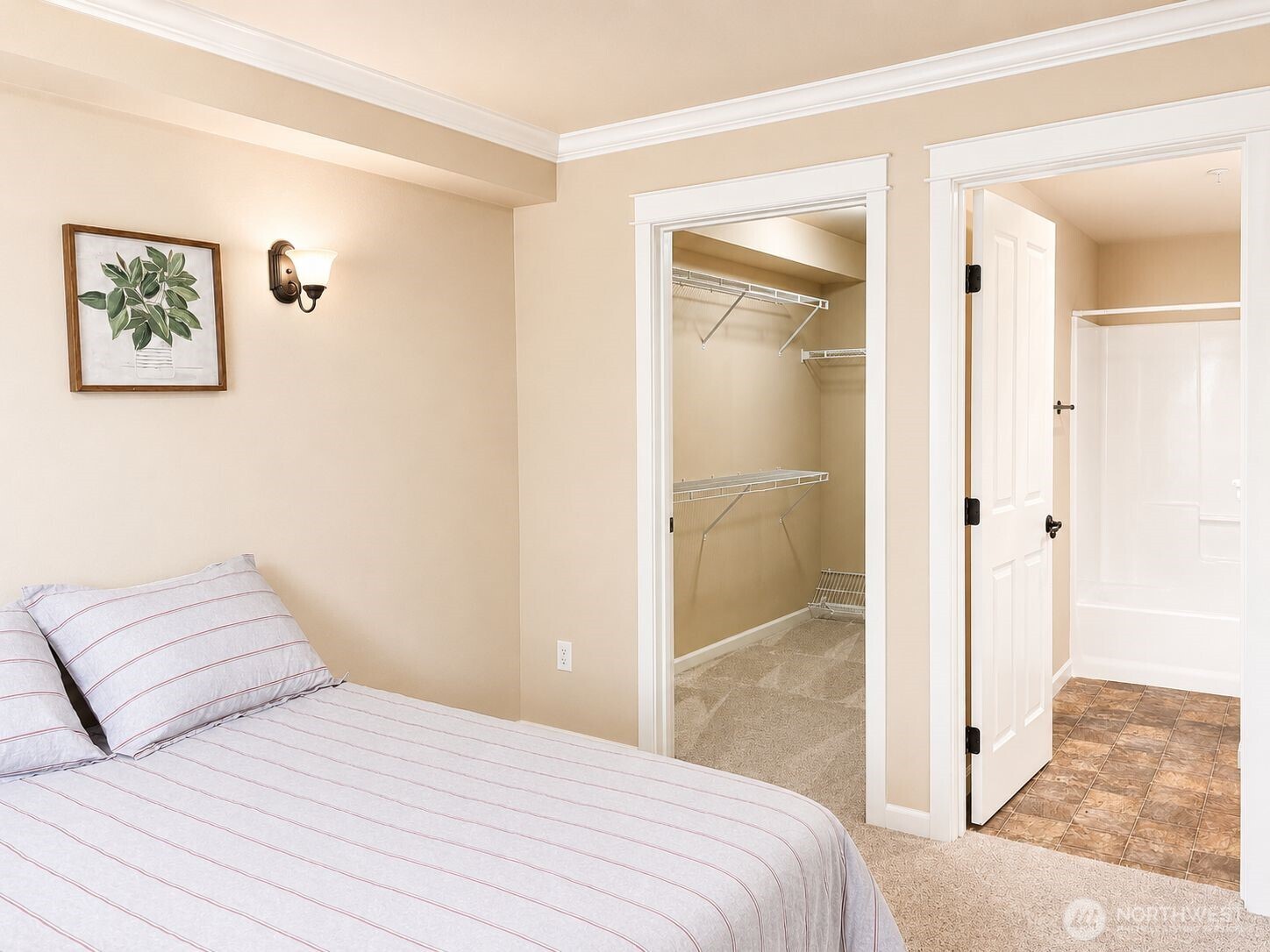 700 32nd Street, Unit A309 Bellingham, WA 98225 - Photo 16 of 28 a bedroom with a bed and a shower
