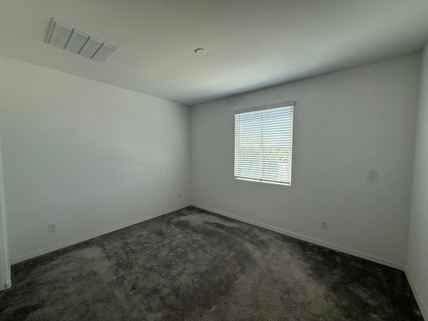 15744 West Jefferson Street Goodyear, AZ 85338 - Photo 4 of 26 an empty room with a window