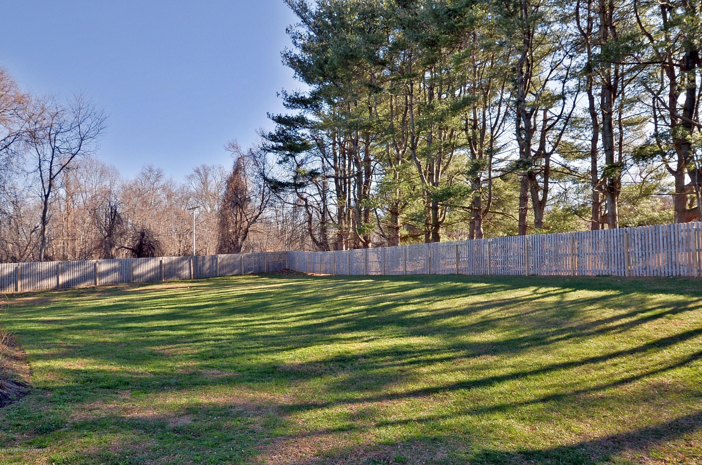 357 Oak Hill Road Middletown, NJ 07701 - Photo 23 of 24 a view of a golf course with a trees
