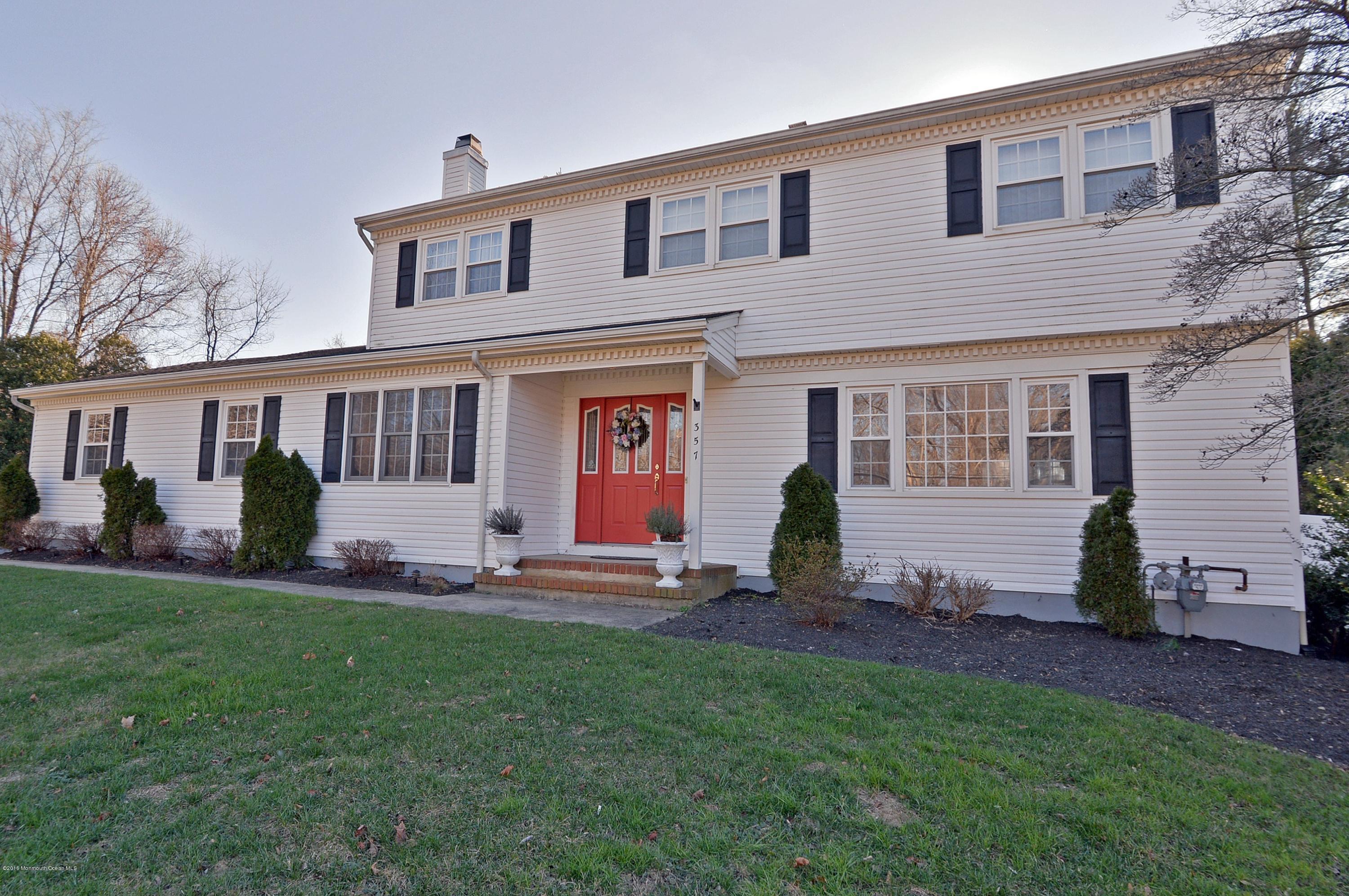 357 Oak Hill Road Middletown, NJ 07701 - Photo 3 of 24 a house view with a sitting space and garden