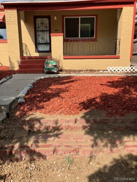 4775 Decatur Street Denver, CO 80211 - Photo 12 of 13 a front view of a house with a yard