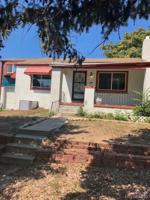 4775 Decatur Street Denver, CO 80211 - Photo 13 of 13 a front view of a house with garden