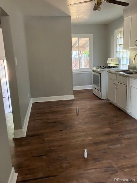4775 Decatur Street Denver, CO 80211 - Photo 3 of 13 a view of a kitchen with wooden floor and electronic appliances