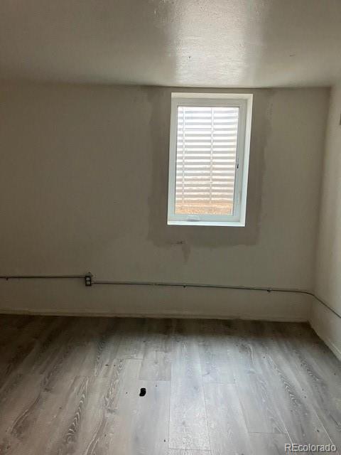 4775 Decatur Street Denver, CO 80211 - Photo 9 of 13 an empty room with a window