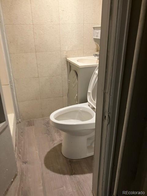 4775 Decatur Street Denver, CO 80211 - Photo 10 of 13 a bathroom with a toilet and a sink