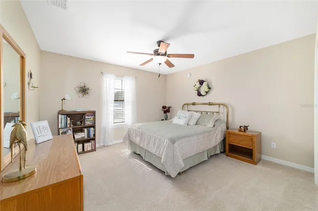 a spacious bedroom with a bed and furniture