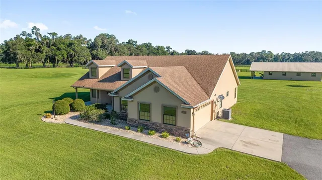 a view of house with backyard space and garden
