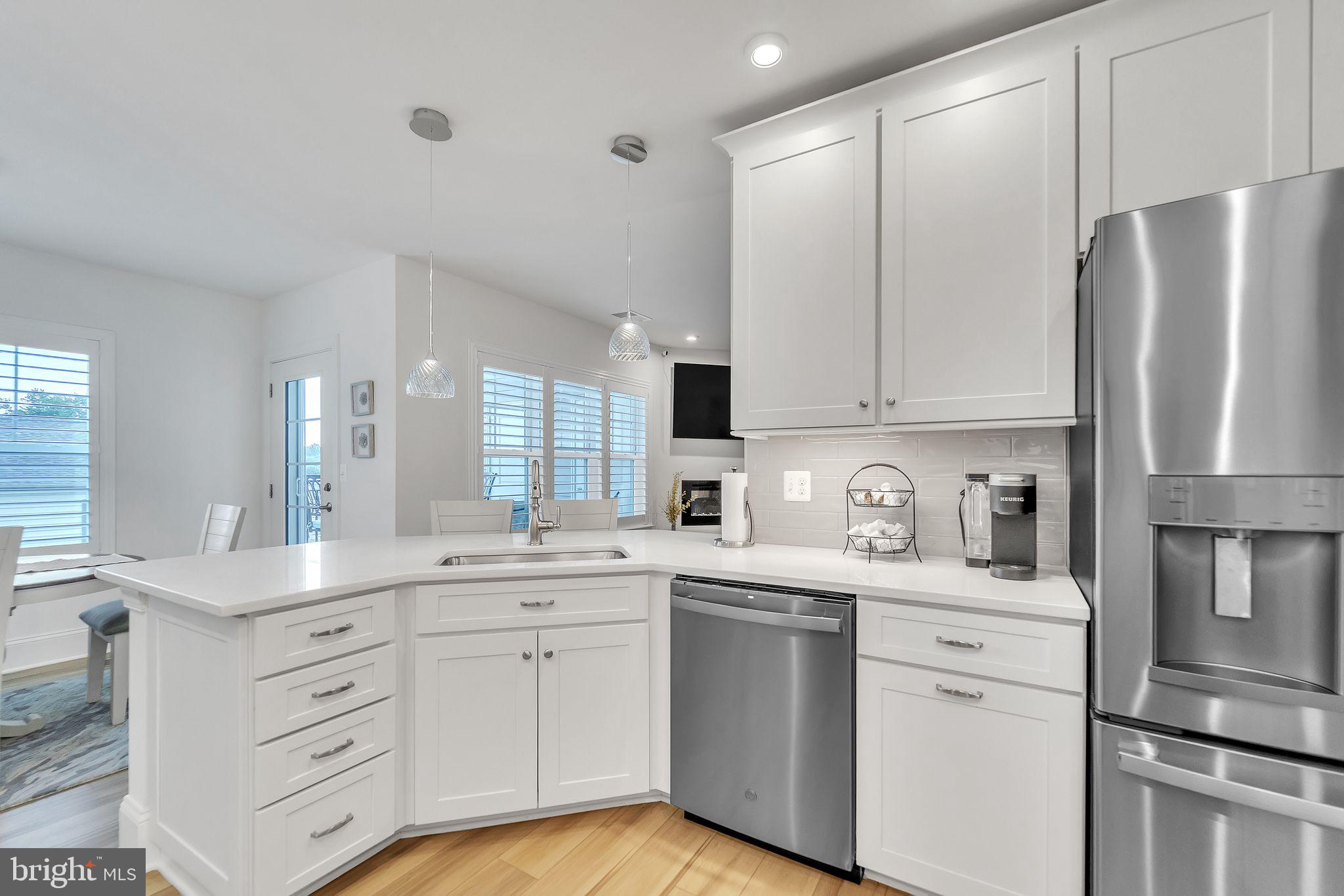 1414 Burke Road, Unit 201 Middle River, MD 21220 - Photo 15 of 35 a kitchen with white cabinets and white appliances