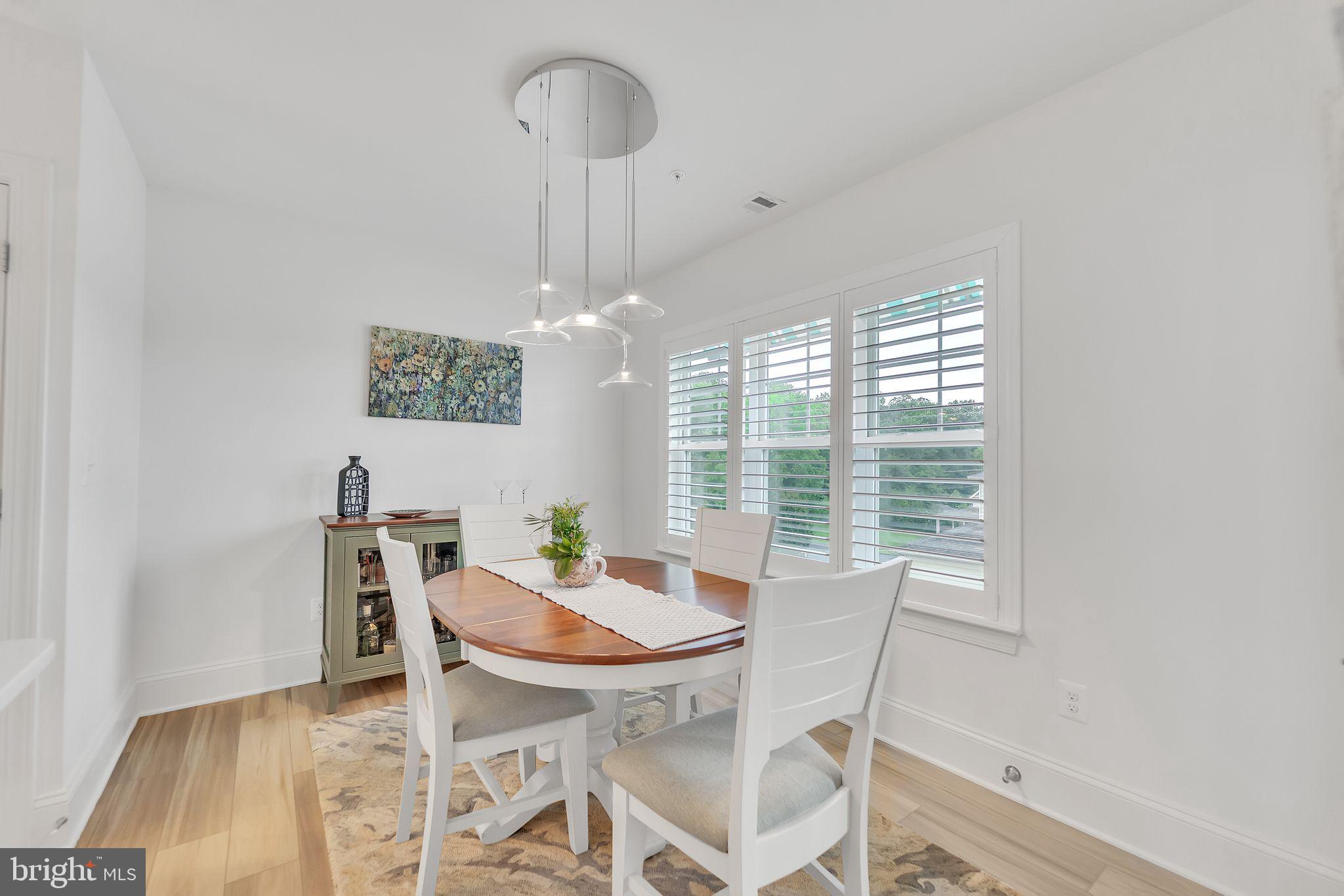 1414 Burke Road, Unit 201 Middle River, MD 21220 - Photo 20 of 35 a view of a dining room with furniture window and outside view