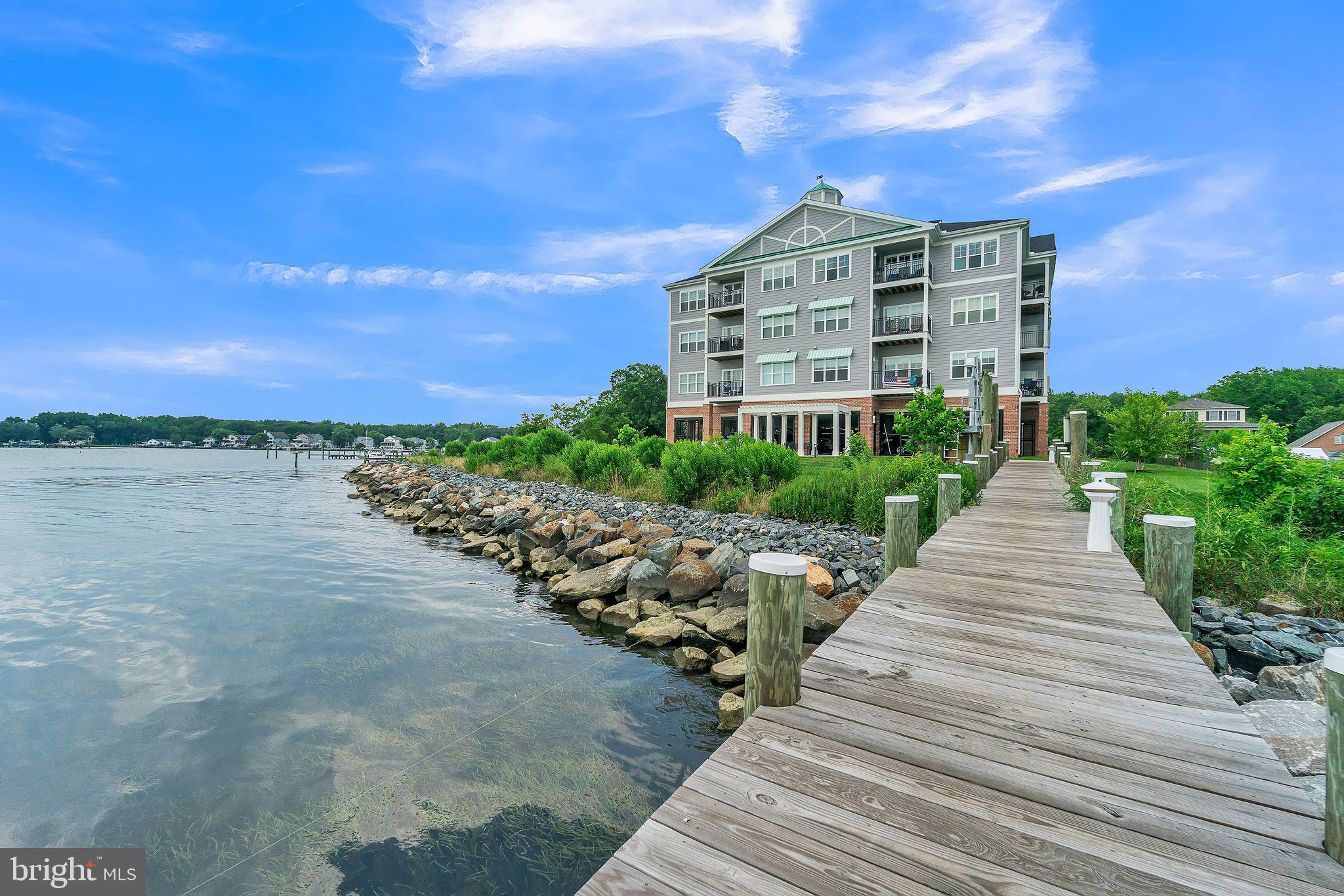 1414 Burke Road, Unit 201 Middle River, MD 21220 - Photo 2 of 35 a view of a brick building next to a yard