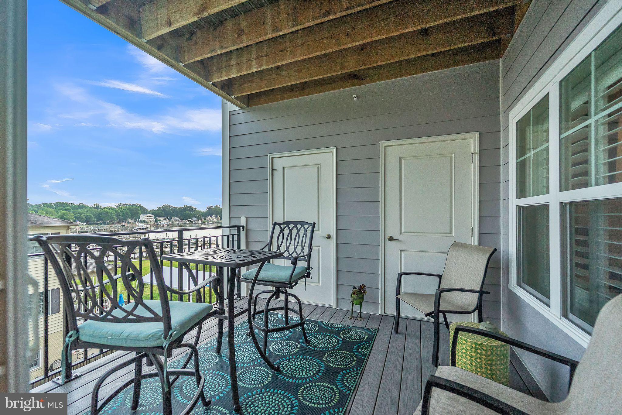 1414 Burke Road, Unit 201 Middle River, MD 21220 - Photo 21 of 35 a view of a chairs and table in the balcony