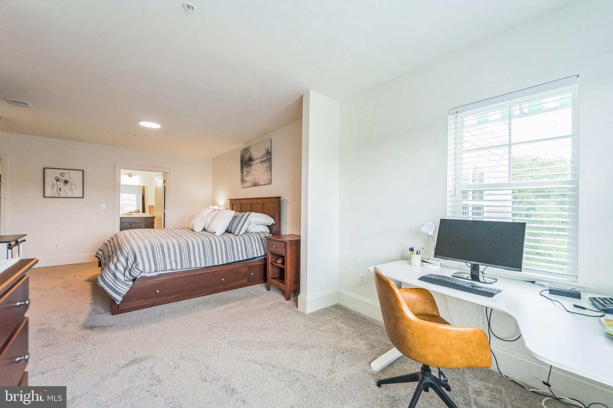 1414 Burke Road, Unit 201 Middle River, MD 21220 - Photo 23 of 35 a bedroom with bed and a window