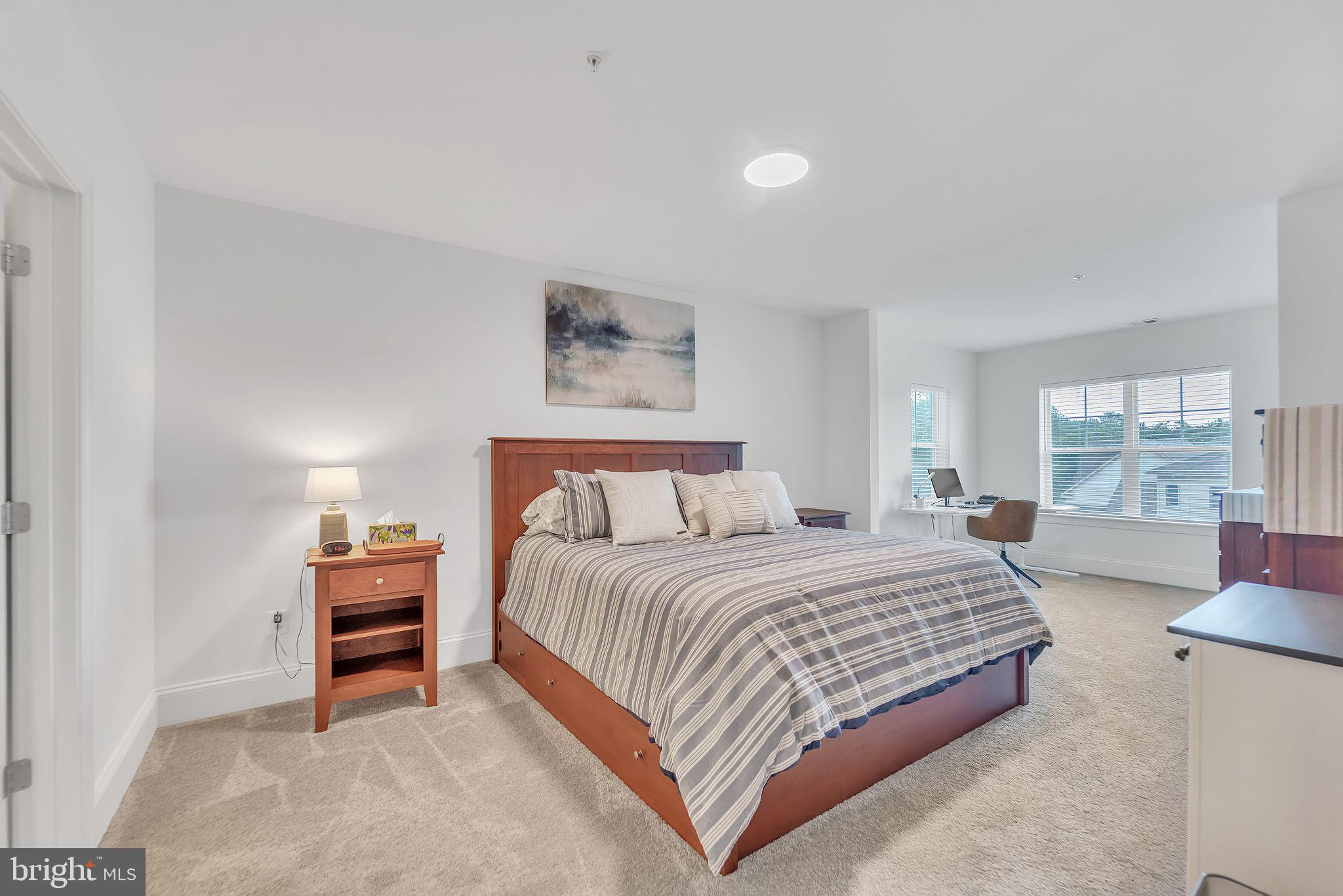 1414 Burke Road, Unit 201 Middle River, MD 21220 - Photo 24 of 35 a bedroom with a bed and a large window