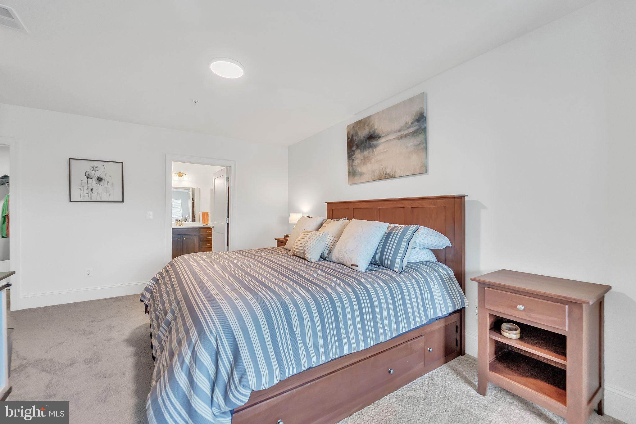 1414 Burke Road, Unit 201 Middle River, MD 21220 - Photo 26 of 35 a bedroom with a bed and a view of kitchen