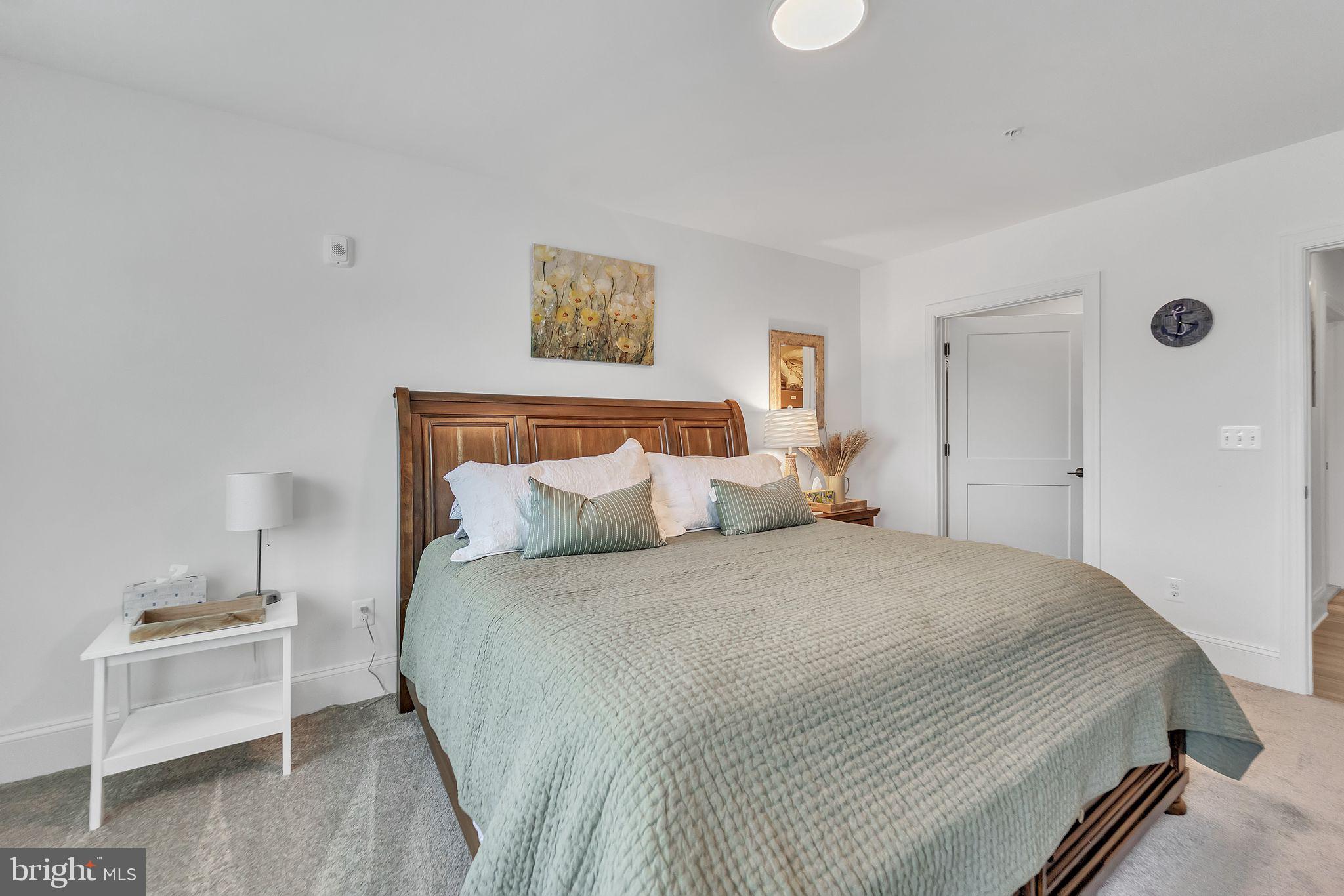 1414 Burke Road, Unit 201 Middle River, MD 21220 - Photo 29 of 35 a bedroom with bed and window