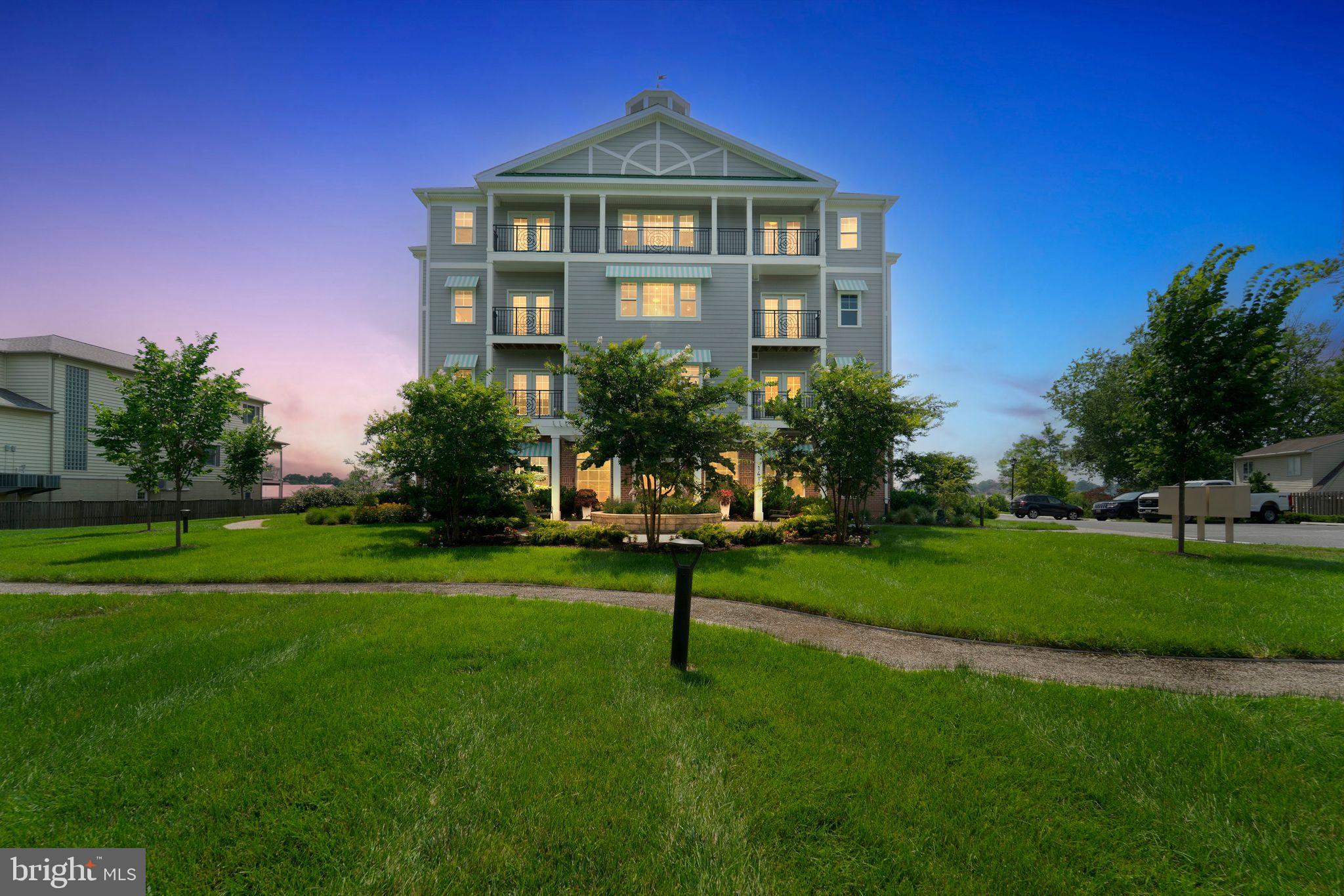 1414 Burke Road, Unit 201 Middle River, MD 21220 - Photo 3 of 35 a front view of a house with a yard