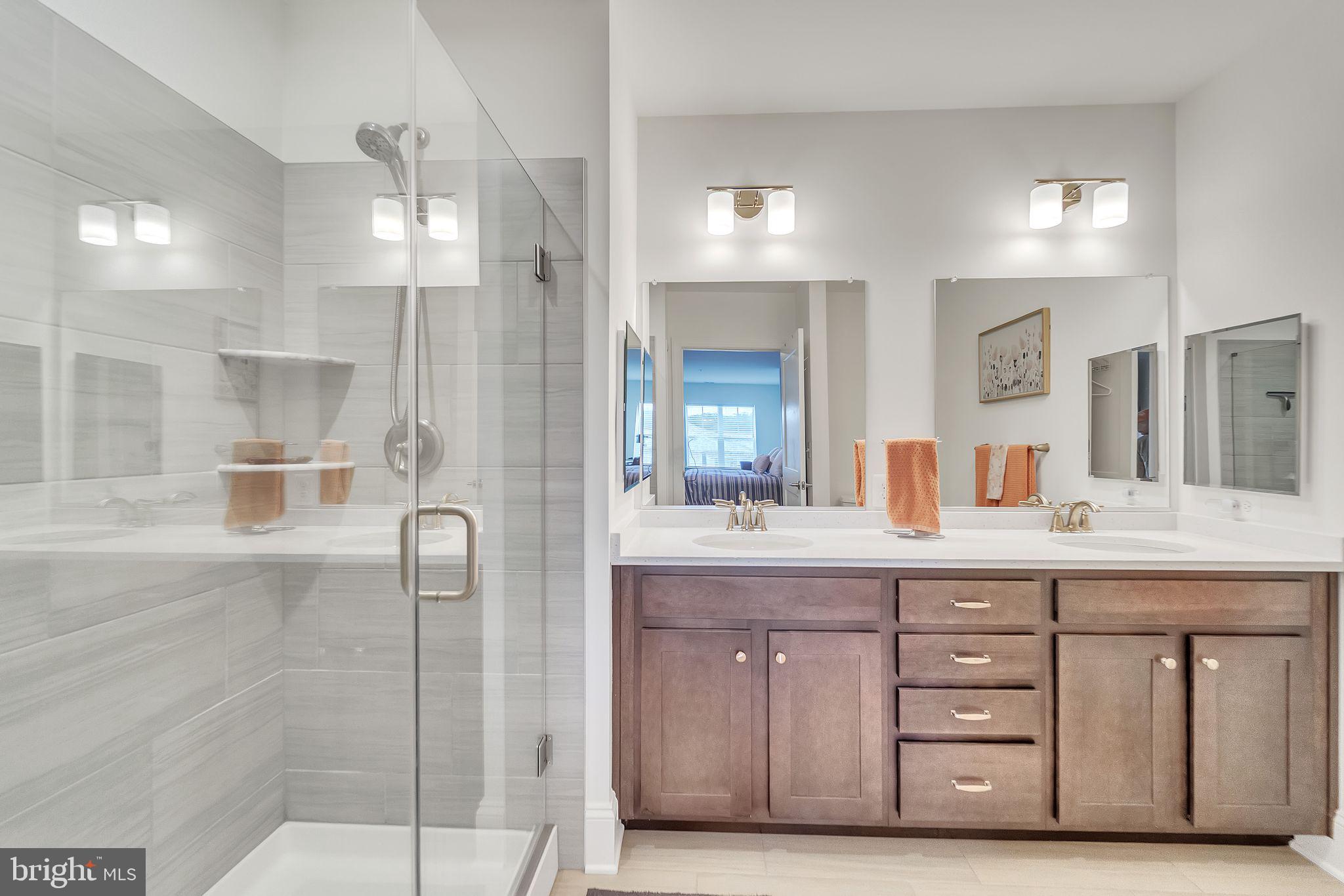 1414 Burke Road, Unit 201 Middle River, MD 21220 - Photo 33 of 35 a bathroom with a granite countertop sink mirror and double