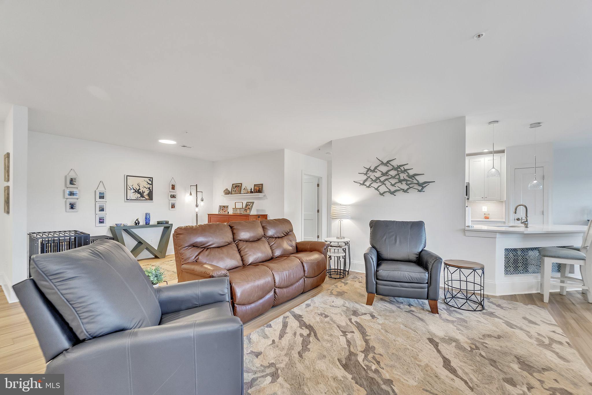 1414 Burke Road, Unit 201 Middle River, MD 21220 - Photo 9 of 35 a living room with furniture and a wooden floor