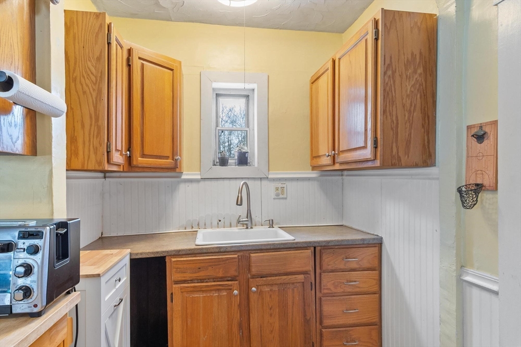 37 Draper Road Gardner, MA 01440 - Photo 14 of 33 a sink a vanity with mirror and window