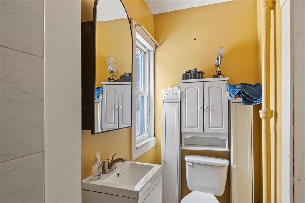 37 Draper Road Gardner, MA 01440 - Photo 15 of 33 a bathroom with a sink a toilet and mirror