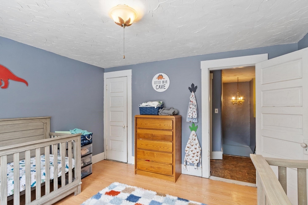 37 Draper Road Gardner, MA 01440 - Photo 26 of 33 a bedroom with a bed and wooden floor